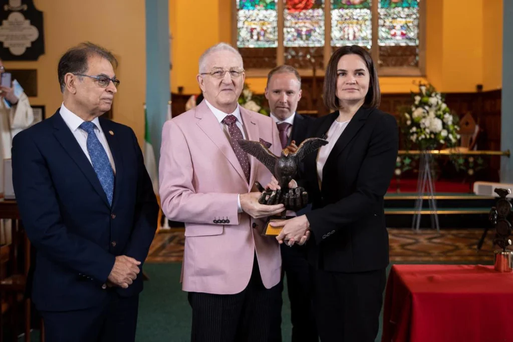 Sviatlana Tsikhanouskaya receives the Tipperary International Peace Award from Martin Quinn, Hon. Secretary, with committee members Guy Jones and John Shanahan