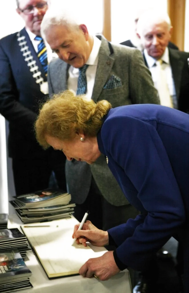 Tipperary Peace Award recipient Mrs. Mary Robinson signs the Visitors Book, November 2019